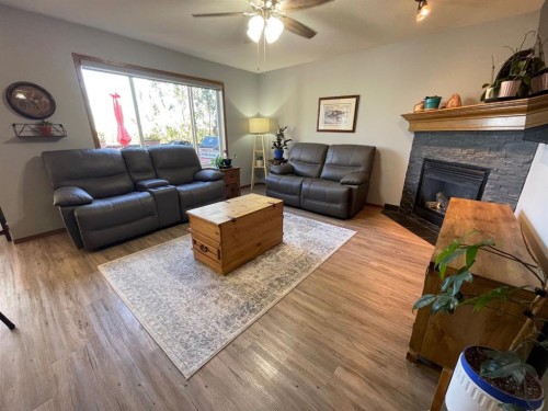 63 Glensummit Close, Cochrane, AB - Indoor Photo Showing Living Room With Fireplace