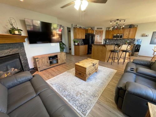 63 Glensummit Close, Cochrane, AB - Indoor Photo Showing Living Room With Fireplace
