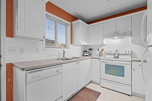 53 Citadel Mesa Close Nw, Calgary, AB - Indoor Photo Showing Kitchen With Double Sink