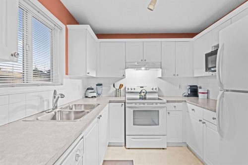 53 Citadel Mesa Close Nw, Calgary, AB - Indoor Photo Showing Kitchen With Double Sink
