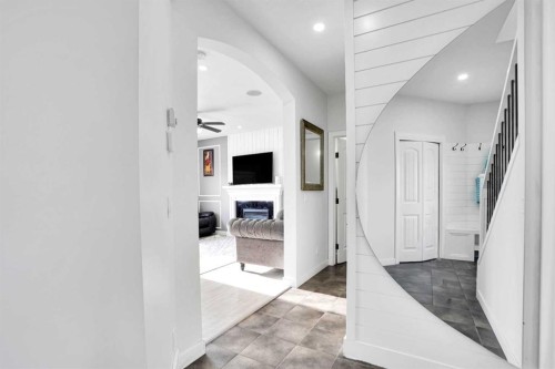 85 Saddlebrook Circle Ne, Calgary, AB - Indoor Photo Showing Other Room With Fireplace