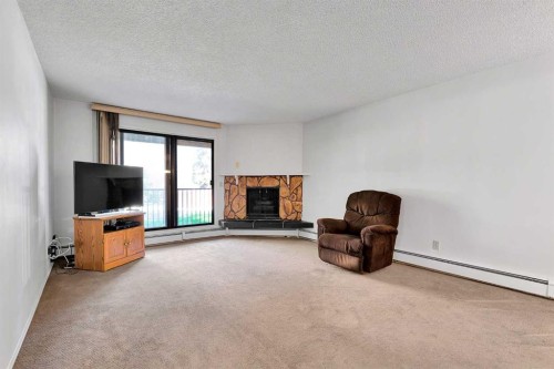 2106-4001B 49 Street Nw, Calgary, AB - Indoor With Fireplace