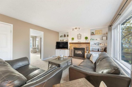 291 Mckerrell Way Se, Calgary, AB - Indoor Photo Showing Living Room With Fireplace