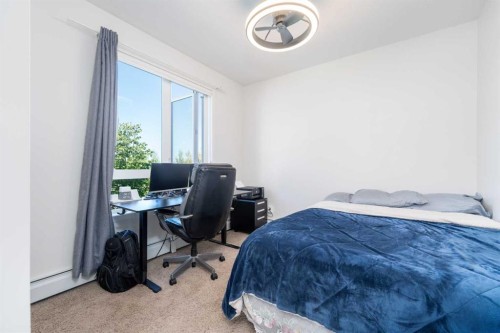2205-175 Silverado Boulevard Sw, Calgary, AB - Indoor Photo Showing Bedroom