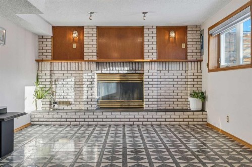 811 19 Avenue Nw, Calgary, AB - Indoor Photo Showing Other Room With Fireplace