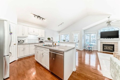3263 Signal Hill Drive Sw, Calgary, AB - Indoor Photo Showing Kitchen With Fireplace With Double Sink