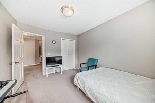 1405 Shawnee Road Sw, Calgary, AB - Indoor Photo Showing Bedroom