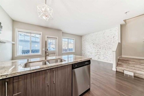 115-300 Marina Drive, Chestermere, AB - Indoor Photo Showing Kitchen With Double Sink