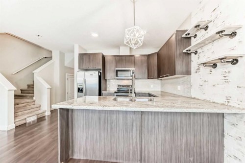 115-300 Marina Drive, Chestermere, AB - Indoor Photo Showing Kitchen With Upgraded Kitchen