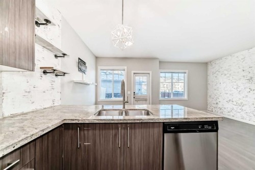 115-300 Marina Drive, Chestermere, AB - Indoor Photo Showing Kitchen With Double Sink With Upgraded Kitchen