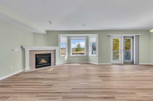 140 Valley Ridge Heights Nw, Calgary, AB - Indoor Photo Showing Living Room With Fireplace