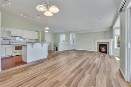 140 Valley Ridge Heights Nw, Calgary, AB - Indoor Photo Showing Kitchen With Fireplace