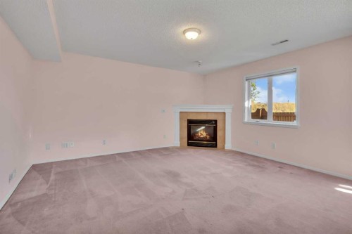 140 Valley Ridge Heights Nw, Calgary, AB - Indoor Photo Showing Living Room With Fireplace