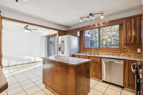 9 Jensen Crescent Ne, Airdrie, AB - Indoor Photo Showing Kitchen With Double Sink