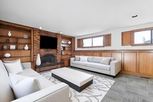 9 Jensen Crescent Ne, Airdrie, AB - Indoor Photo Showing Living Room With Fireplace