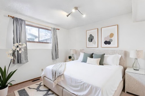 9 Jensen Crescent Ne, Airdrie, AB - Indoor Photo Showing Bedroom