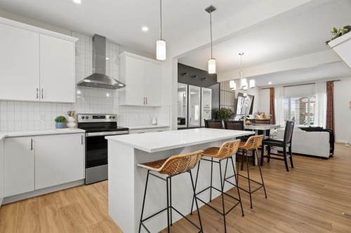 10 Emberside Link, Cochrane, AB - Indoor Photo Showing Kitchen With Upgraded Kitchen