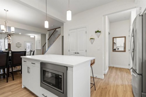 10 Emberside Link, Cochrane, AB - Indoor Photo Showing Kitchen With Upgraded Kitchen