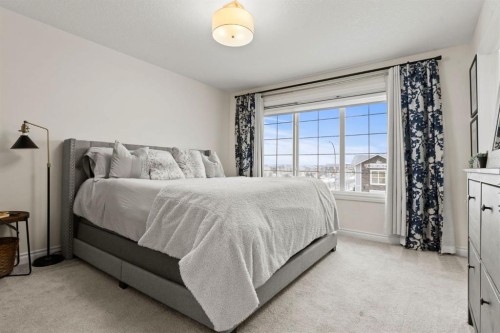 10 Emberside Link, Cochrane, AB - Indoor Photo Showing Bedroom