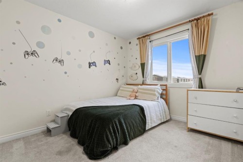 10 Emberside Link, Cochrane, AB - Indoor Photo Showing Bedroom