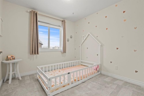 10 Emberside Link, Cochrane, AB - Indoor Photo Showing Bedroom