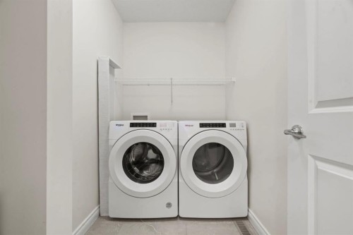 10 Emberside Link, Cochrane, AB - Indoor Photo Showing Laundry Room