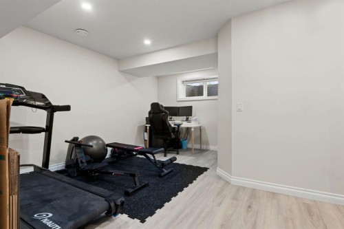 10 Emberside Link, Cochrane, AB - Indoor Photo Showing Gym Room