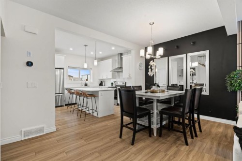 10 Emberside Link, Cochrane, AB - Indoor Photo Showing Dining Room