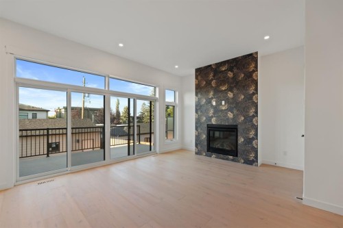 2436 30 Avenue Sw, Calgary, AB - Indoor Photo Showing Living Room With Fireplace