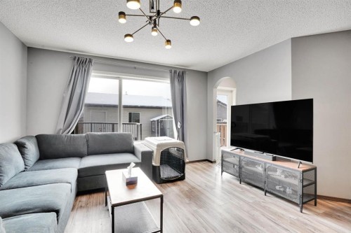 210 Cranberry Place Se, Calgary, AB - Indoor Photo Showing Living Room