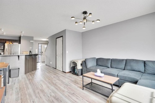 210 Cranberry Place Se, Calgary, AB - Indoor Photo Showing Living Room