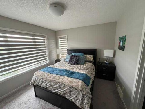 202 Evansridge Park Nw, Calgary, AB - Indoor Photo Showing Bedroom