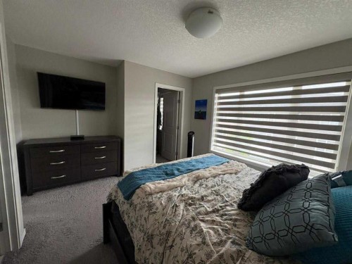202 Evansridge Park Nw, Calgary, AB - Indoor Photo Showing Bedroom