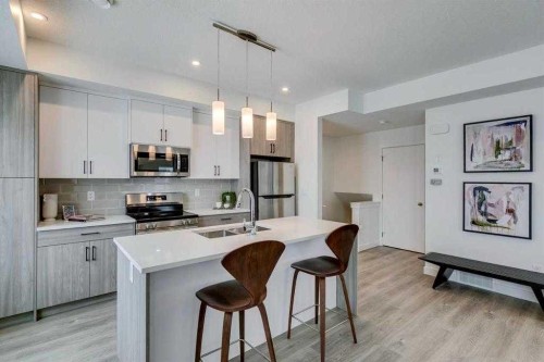 72-2117 81St Street Sw, Calgary, AB - Indoor Photo Showing Kitchen With Stainless Steel Kitchen With Double Sink With Upgraded Kitchen
