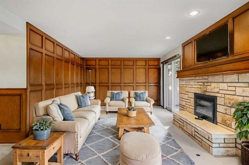 720 Parkvalley Road Se, Calgary, AB - Indoor Photo Showing Living Room With Fireplace