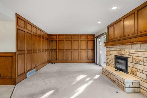 720 Parkvalley Road Se, Calgary, AB - Indoor Photo Showing Other Room With Fireplace