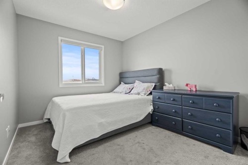 66 Howse Common Ne, Calgary, AB - Indoor Photo Showing Bedroom