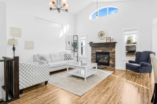 811 Boulder Creek Drive Se, Langdon, AB - Indoor Photo Showing Living Room With Fireplace