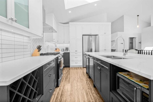 811 Boulder Creek Drive Se, Langdon, AB - Indoor Photo Showing Kitchen With Stainless Steel Kitchen With Double Sink With Upgraded Kitchen