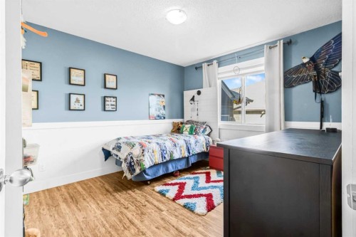 811 Boulder Creek Drive Se, Langdon, AB - Indoor Photo Showing Bedroom