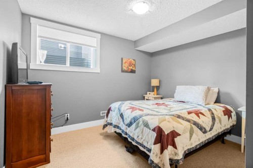 811 Boulder Creek Drive Se, Langdon, AB - Indoor Photo Showing Bedroom