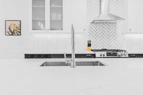 811 Boulder Creek Drive Se, Langdon, AB - Indoor Photo Showing Kitchen With Stainless Steel Kitchen With Double Sink With Upgraded Kitchen