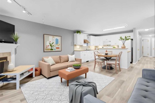 102-139 26 Avenue Nw, Calgary, AB - Indoor Photo Showing Living Room