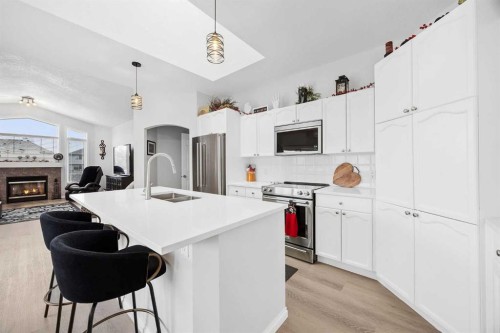 127 Invermere Close, Chestermere, AB - Indoor Photo Showing Kitchen With Stainless Steel Kitchen With Double Sink With Upgraded Kitchen