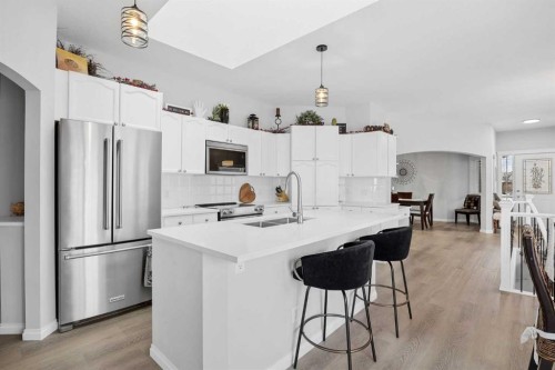 127 Invermere Close, Chestermere, AB - Indoor Photo Showing Kitchen With Stainless Steel Kitchen With Double Sink With Upgraded Kitchen