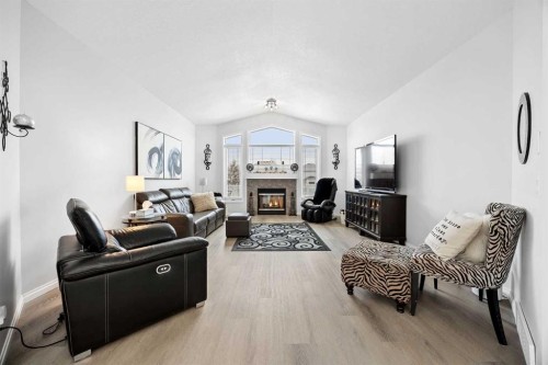 127 Invermere Close, Chestermere, AB - Indoor Photo Showing Living Room With Fireplace
