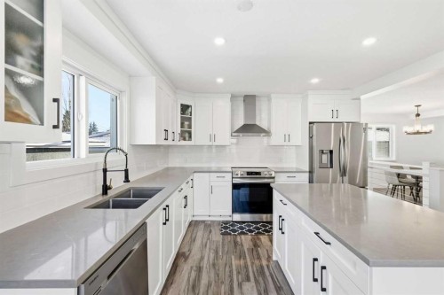 69 Harrow Crescent Sw, Calgary, AB - Indoor Photo Showing Kitchen With Stainless Steel Kitchen With Double Sink With Upgraded Kitchen