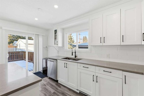 69 Harrow Crescent Sw, Calgary, AB - Indoor Photo Showing Kitchen With Double Sink