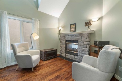124 Cresthaven Place Sw, Calgary, AB - Indoor Photo Showing Living Room With Fireplace