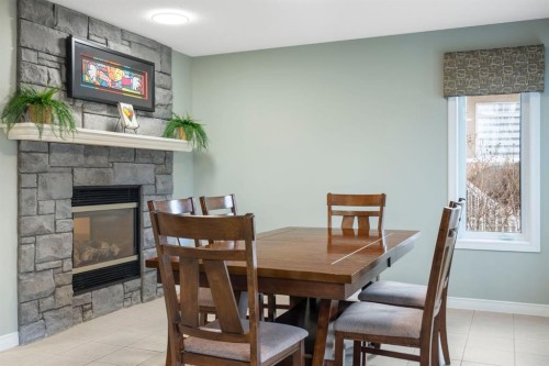 124 Cresthaven Place Sw, Calgary, AB - Indoor Photo Showing Dining Room With Fireplace